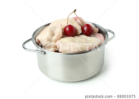 Pot with pierogi with cherry isolated on white background Pot with pierogi with cherry isolated on white background 88001075