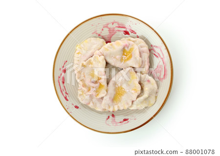 Plate with pierogi with cherry isolated on white background Plate with pierogi with cherry isolated on white background 88001078
