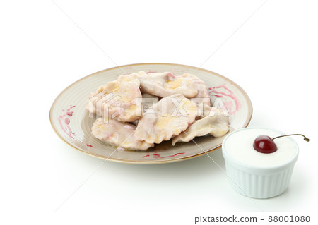 Plate with pierogi with cherry isolated on white background Plate with pierogi with cherry isolated on white background 88001080