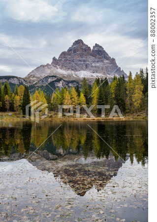 Tre Cime di Lavaredo peaks and Lake Antorno with sky reflection in calm water. Dolomites Alp Mountains, Belluno Province, Dolomiti Alps, Italy 88002357