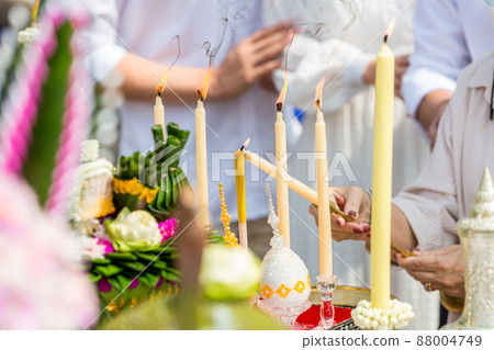 Lighting a Wax Candle Stub Using a Fire Candle. Candle lighting by Fire Candle. Lighting a Wax Candle Stub Using a Fire Candle. Candle lighting by Fire Candle. 88004749
