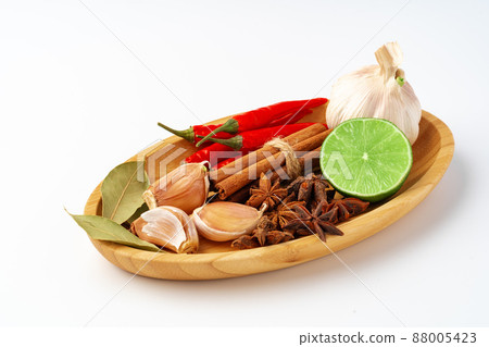 Composition with wooden board and ingredients for cooking on white Composition with wooden board and ingredients for cooking on white 88005423