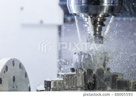 a process of industrial wet milling in 5-axis cnc machine with coolant flow under pressure and freezed splashes 88005593