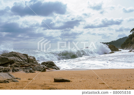 High Tides Coming on to the Rocky Shores of Costa Brava in Spain, cloudy weather 88005838
