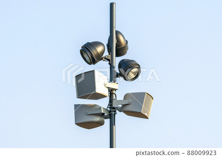 Speakers and lights suspended from a metal pole Speakers and lights suspended from a metal pole 88009923