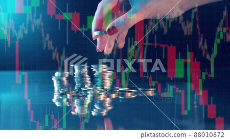 Multilayered display with stock charts and a pile of coins Multilayered display with stock charts and a pile of coins 88010872