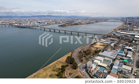 Aerial view of the scenery around the mouth of the Yodo River in Konohana-ku, Osaka with a drone Aerial view of the scenery around the mouth of the Yodo River in Konohana-ku, Osaka with a drone 88010928