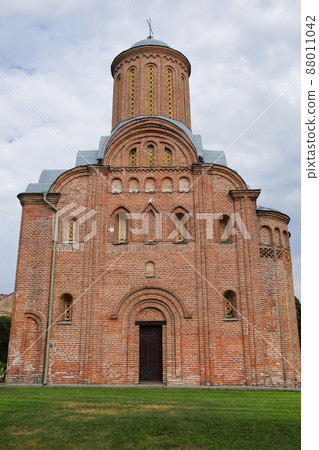 Medieval brick church in the Ukrainian city of Chernihiv. Medieval architecture. Church on a cloudy day. Friday Church in Chernihiv (Church of St. Paraskevi Friday at Torg). Medieval brick church in the Ukrainian city of Chernihiv. Medieval architecture. Church on a cloudy day. Friday Church in Chernihiv (Church of St. Paraskevi Friday at Torg). 88011042