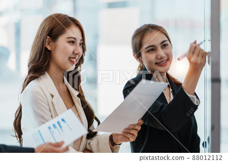 At meeting room. Success Business woman showing the vision and drawing flow chart on white board. At meeting room. Success Business woman showing the vision and drawing flow chart on white board. 88012112