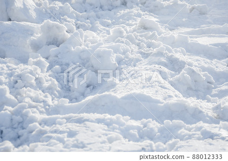 Uneven snowdrift of loose snow. Winter background. It's frosty day. Uneven snowdrift of loose snow. Winter background. It's frosty day. 88012333