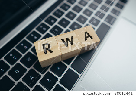 Concept Risk weighted asset or RWA. business acronym. Cubes with letters on a laptop. Concept Risk weighted asset or RWA. business acronym. Cubes with letters on a laptop. 88012441