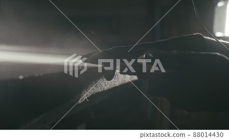 Glass cutting and processing for fireplace doors. Circular glass cutter. Worker cut glass with glass cutting diamond. Glass cutting and processing for fireplace doors. Circular glass cutter. Worker cut glass with glass cutting diamond. 88014430