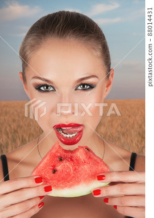 Girl holding slice of watermelon Girl holding slice of watermelon 88014431