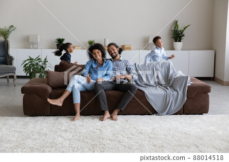 Positive happy young African parents home full length portrait Positive happy young African parents home full length portrait 88014518
