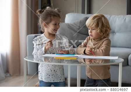 Happy cute little kids siblings drawing pictures at home. 88014697