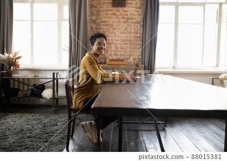 Happy business woman, freelance employee, entrepreneur working at laptop 88015381