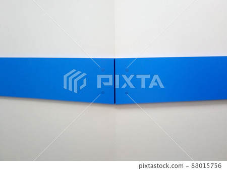 Background of the corner of a white wall with a blue stripe 88015756