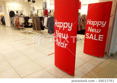 Holiday discount in shopping malls, New Year's sale in shopping malls. Christmas promotion in a clothing store. Holiday discount in shopping malls, New Year's sale in shopping malls. Christmas promotion in a clothing store. 88015761