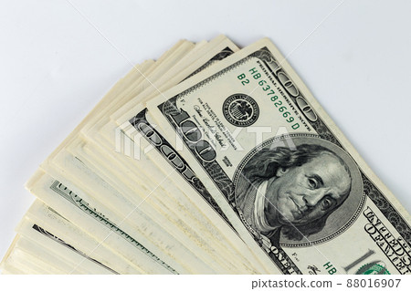 a skewed stack of old us dollar banknotes on white background - close shot 88016907