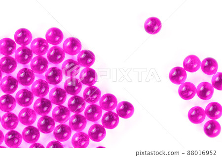 plastic pink spherical ball capsules with selective focus isolated on white background plastic pink spherical ball capsules with selective focus isolated on white background 88016952