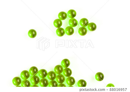 ufo green spherical ball capsules with selective focus isolated on white background ufo green spherical ball capsules with selective focus isolated on white background 88016957