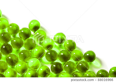 ufo green spherical ball capsules with selective focus isolated on white background 88016966