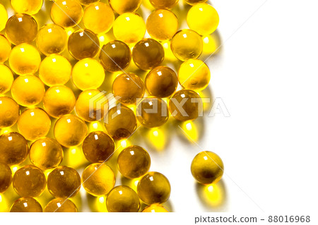 orange spherical ball capsules of fish oil selective focus isolated on white background orange spherical ball capsules of fish oil selective focus isolated on white background 88016968