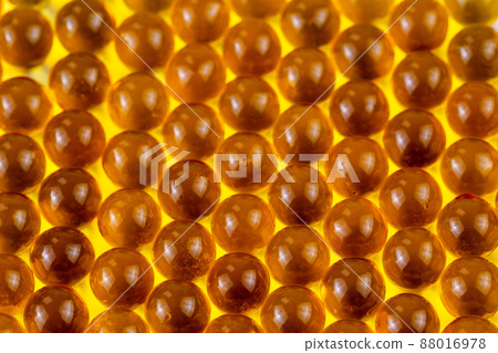 orange spherical ball capsules of fish oil selective focus background 88016978