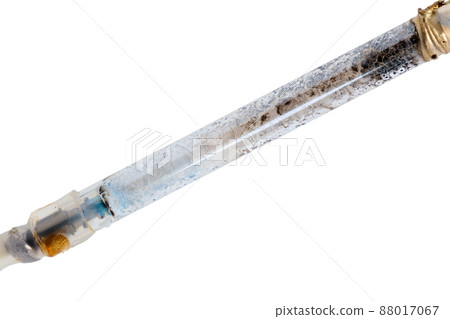 broken xenon flashgun lamp closeup isolated on white background broken xenon flashgun lamp closeup isolated on white background 88017067