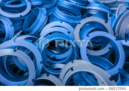 an abstract background of classic blue color coated metal ring parts 88017084
