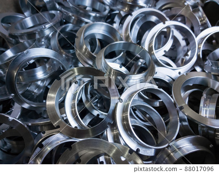 a batch of machined shiny metal parts with selective focus a batch of machined shiny metal parts with selective focus 88017096