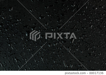 water drops on flat black rubber surface macro background water drops on flat black rubber surface macro background 88017136