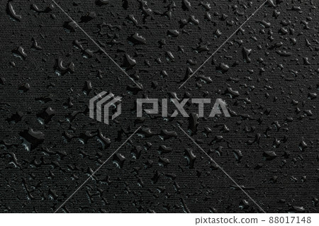 water drops on black flat rubber surface macro background water drops on black flat rubber surface macro background 88017148