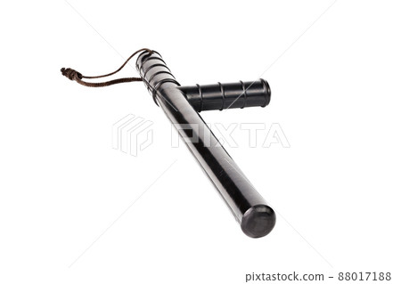 Black classic rubber police tonfa baton isolated on white background. Black classic rubber police tonfa baton isolated on white background. 88017188