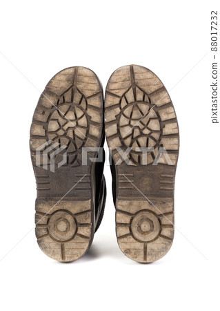 Sole bottom of a pair workboots with acid and oil resistance ability. Isolated on white background. Sole bottom of a pair workboots with acid and oil resistance ability. Isolated on white background. 88017232