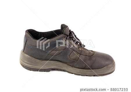 One used blue leather work shoe with fabric incuts isolated on white background One used blue leather work shoe with fabric incuts isolated on white background 88017233