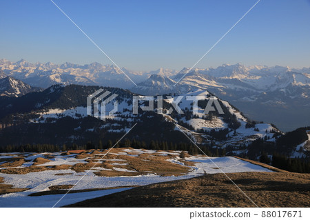 Mountain ranges of Schwyz Canton just before sunset. 88017671