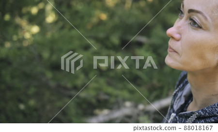 Traveler photographing scenic view in forest. One caucasian woman shooting close up look. Girl take photo video on dslr mirrorless camera. Traveler photographing scenic view in forest. One caucasian woman shooting close up look. Girl take photo video on dslr mirrorless camera. 88018167