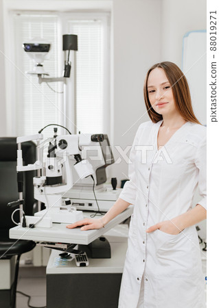 Attractive woman ophthalmologist in ophthalmology clinic. optics salon. Attractive woman ophthalmologist in ophthalmology clinic. optics salon. 88019271