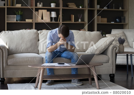 Frustrated businessman hide face in palms deal with debt bankruptcy Frustrated businessman hide face in palms deal with debt bankruptcy 88020010