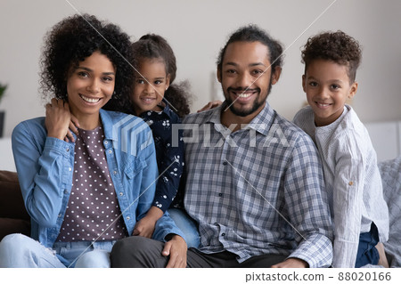 Positive African family couple and two cute little sibling kids 88020166