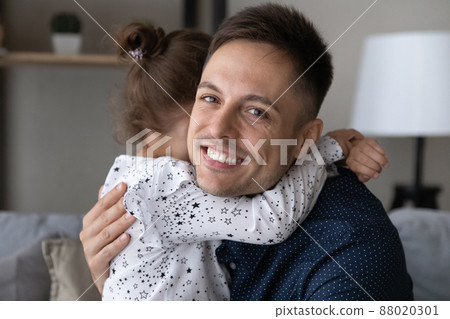 Happy young father cuddling cute kid daughter. Happy young father cuddling cute kid daughter. 88020301