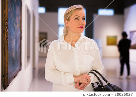 Closeup on mature female visiting museum 88026027