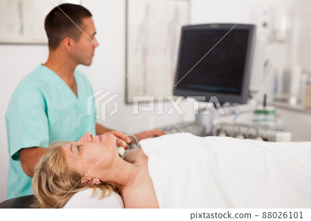 Female patient during ultrasound diagnostic Female patient during ultrasound diagnostic 88026101
