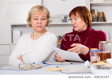 Serious old women with public utilities 88026167