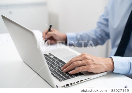 Business man working by using laptop computer Hands typing on a keyboard. Professional investor working new start up project. business planning in office. Technology business 88027559