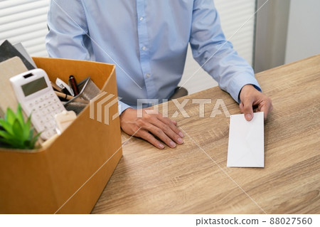 sending resignation letter to boss and Holding Stuff Resign Depress or carrying cardboard box by desk in office sending resignation letter to boss and Holding Stuff Resign Depress or carrying cardboard box by desk in office 88027560
