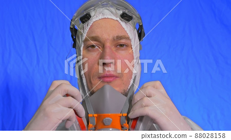 Scientist virologist in respirator. Man close up look, wearing protective medical mask. Concept health safety N1H1 coronavirus epidemic 2019 nCoV. 88028158