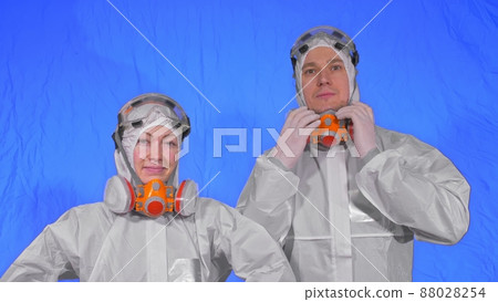 Doctor health worker in respirator. Slow motion. People portrait, wearing protect medical antibacterial antiviral aerosol spray paint mask. 88028254