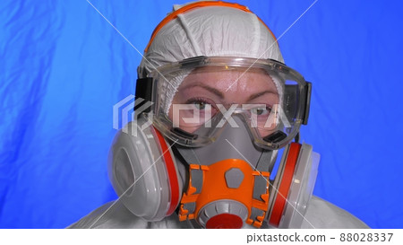 Scientist virologist in respirator. Woman close up look, wearing protective medical mask. Concept health safety N1H1 coronavirus epidemic 2019 nCoV. 88028337